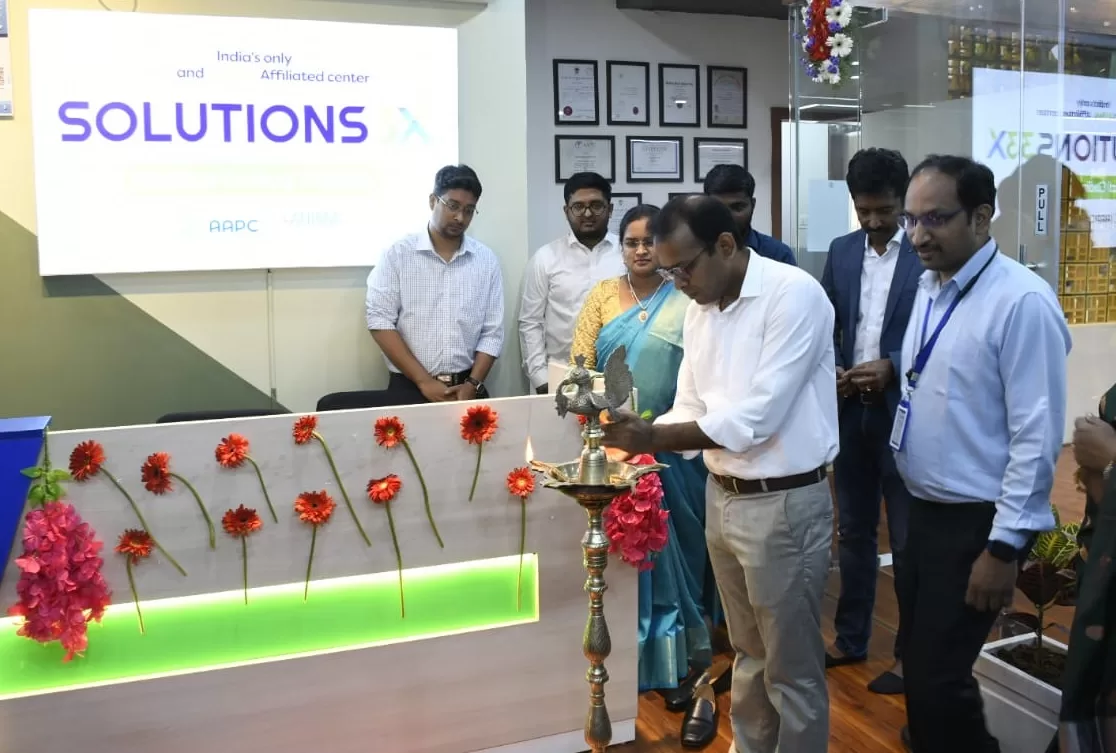 Mr. Muthu Kumaran Gandhi, CEO of Solutions3X Medical Coding Training, lights the lamp to inaugurate the new facility